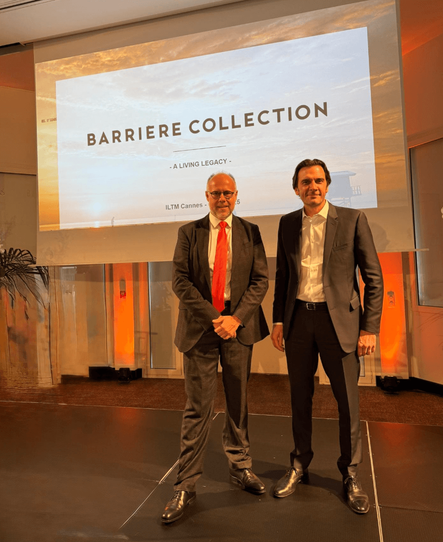 Présentation de Barrière Collection à l'ILTM Cannes : deux dirigeants sur scène devant l'écran A Living Legacy