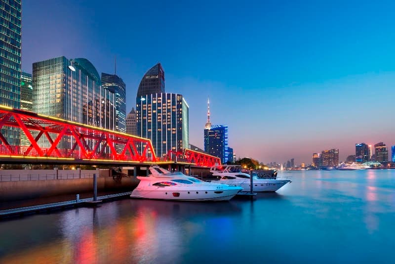 The contemporary facade of the Mandarin Oriental Shanghai along the Huangpu River