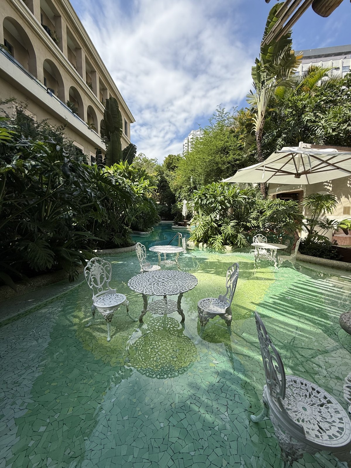 Outdoor pool and gardens at Rosewood São Paulo