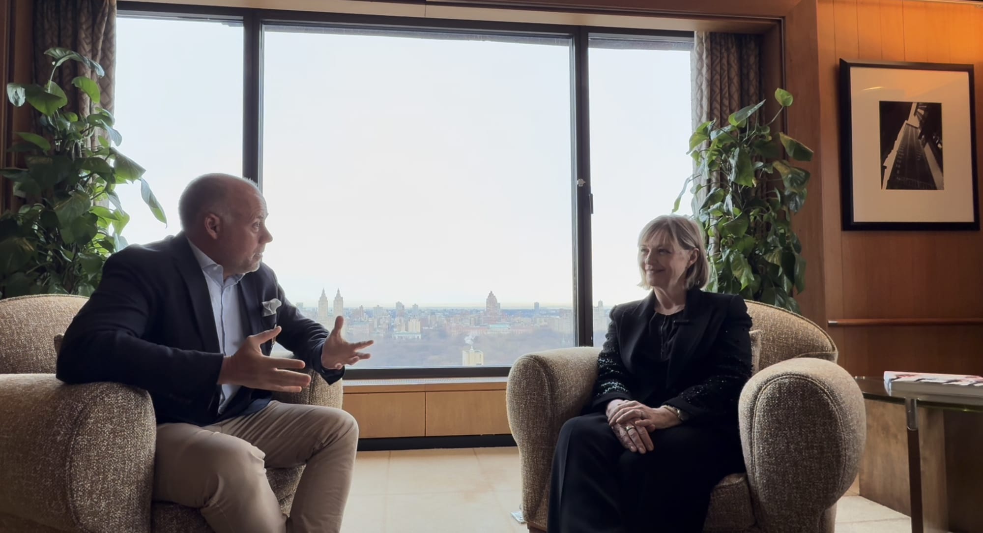 Laurent Delporte in conversation with Marlene Poynder in a Carlyle lounge overlooking Central Park