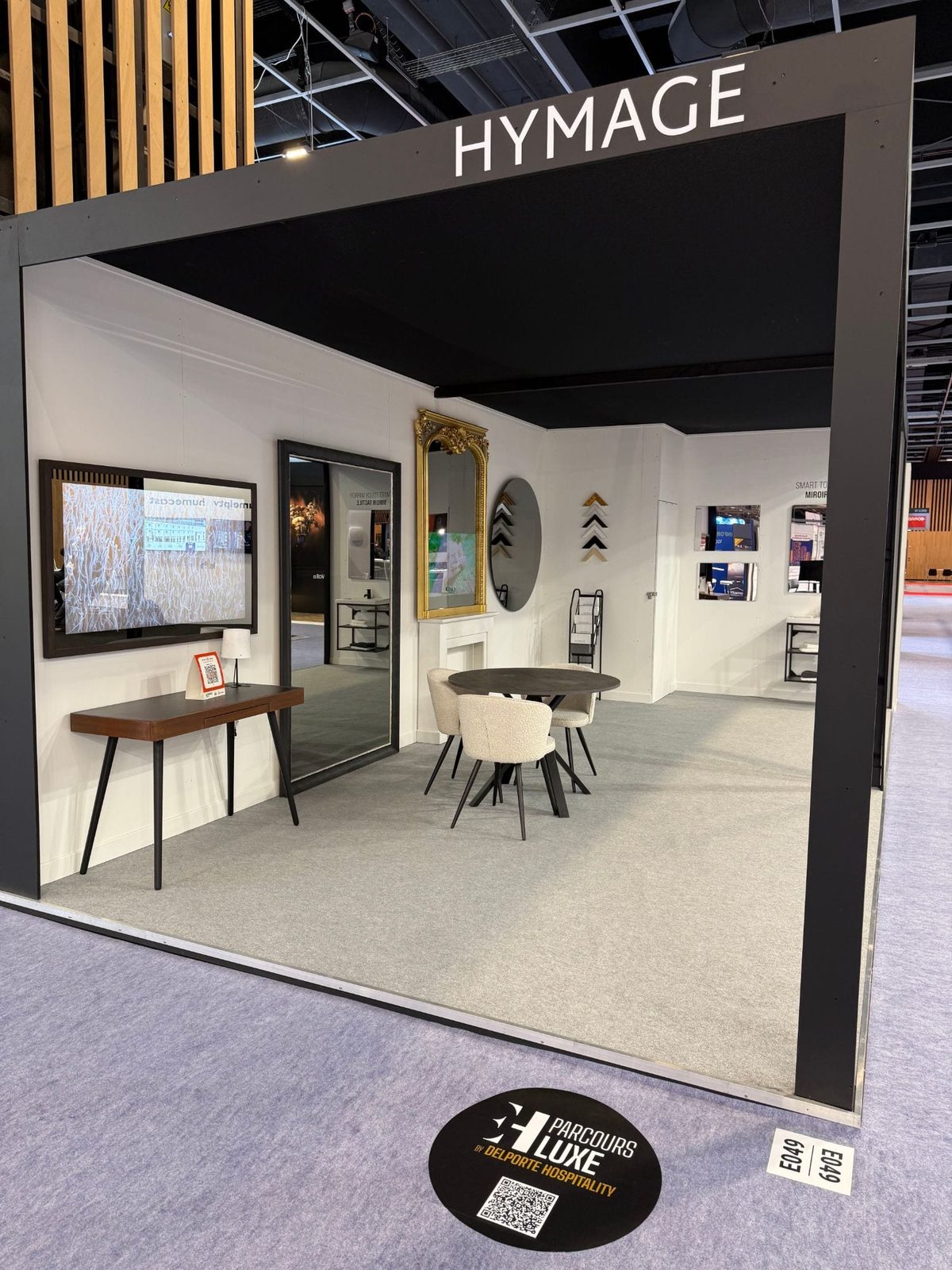 Luxury Trail floor marker in front of the Hymage stand